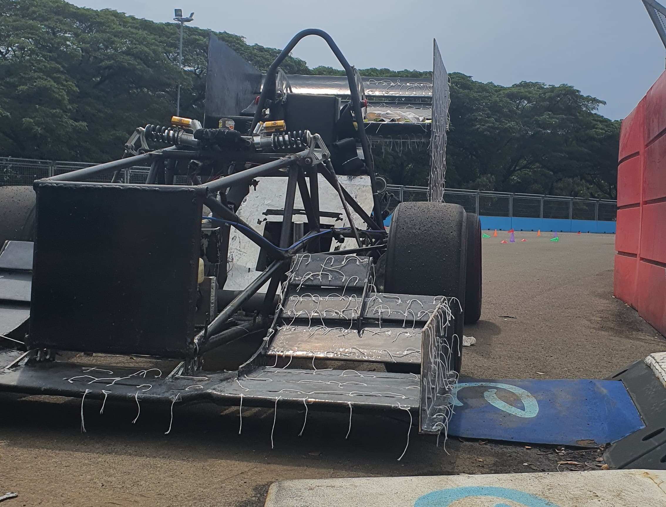 Formula Student front wing CAD, CFD visualization, and installed vehicle photo