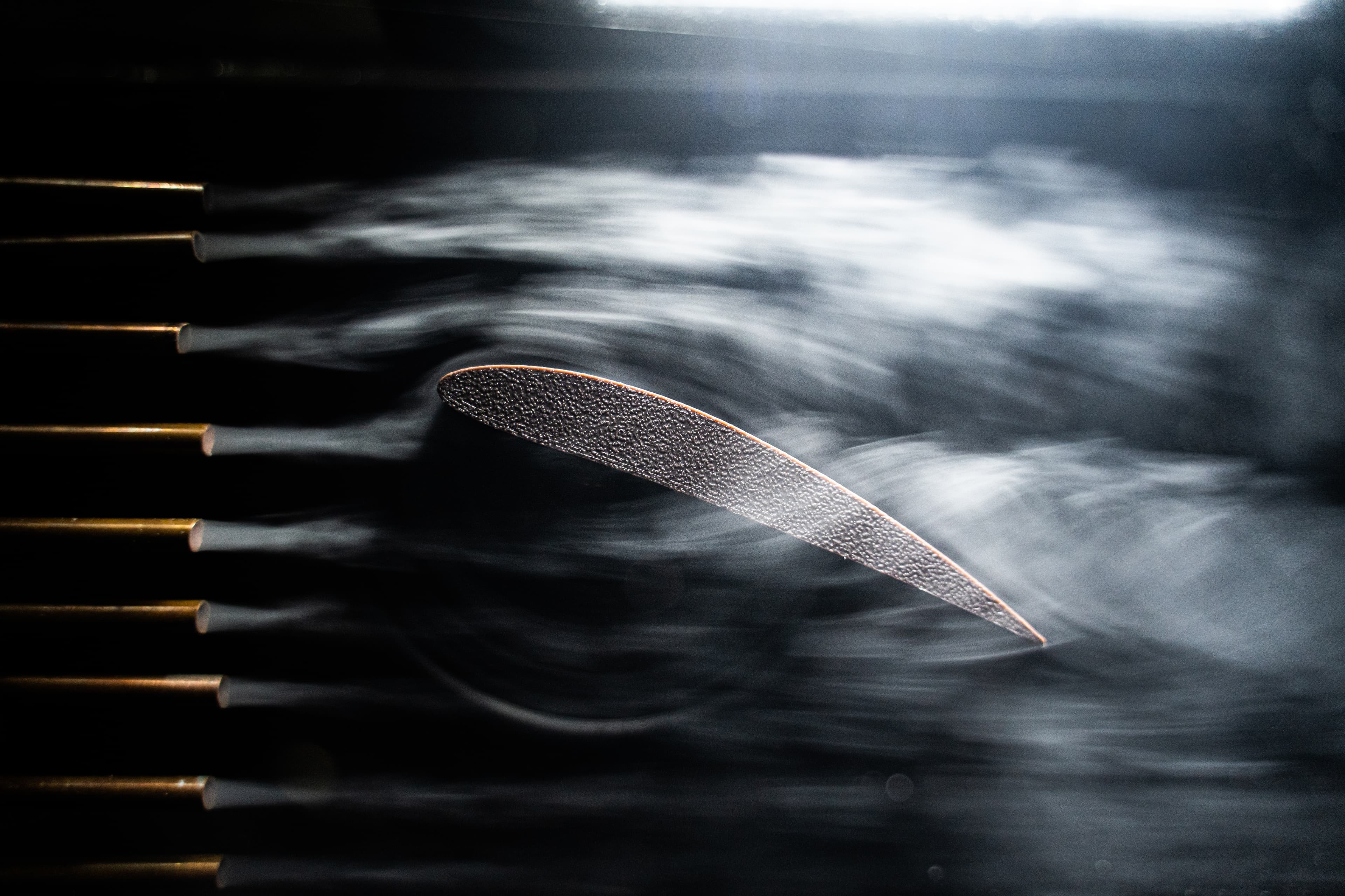Small scale subsonic wind tunnel CAD, fabricated parts, and smoke visualization photos